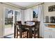 Cozy dining area with a view of the backyard through sliding glass doors and natural light at 200 Vista Blvd, Brighton, CO 80603
