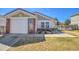 Beautiful home with brick accents, lovely landscaping, and an attached two car garage at 200 Vista Blvd, Brighton, CO 80603