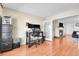 Open-concept living area with office space adjacent to the fireplace and living room at 200 Vista Blvd, Brighton, CO 80603