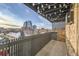 Charming balcony with string lights that offers a relaxing and cozy outdoor space at 65 N Clarkson St # 604, Denver, CO 80218