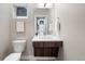 Modern half bath with floating vanity, stylish mirror, and sleek fixtures, offering a chic space at 4469 Tennyson St # 15, Denver, CO 80212