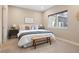 Bright bedroom featuring neutral tones, a large window, and stylish modern decor at 4469 Tennyson St # 15, Denver, CO 80212
