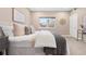 Serene bedroom with plush bedding, a large window, and contemporary decor at 4469 Tennyson St # 15, Denver, CO 80212