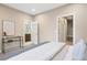 Bright bedroom featuring neutral tones and a glimpse of the attached bathroom at 4469 Tennyson St # 15, Denver, CO 80212