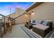 Relax on the rooftop deck featuring comfortable seating and stylish decor at 4469 Tennyson St # 15, Denver, CO 80212