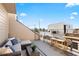 Relaxing rooftop deck featuring comfortable seating and mountain views at 4469 Tennyson St # 15, Denver, CO 80212