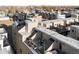 Relax on this townhome rooftop deck, offering a cozy seating area and a private outdoor retreat at 4469 Tennyson St # 15, Denver, CO 80212