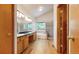 Bathroom features a double sink vanity, soaking tub, and separate shower stall at 13673 Cook St, Thornton, CO 80602
