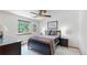 Cozy bedroom with a ceiling fan, a window with natural light, and neutral wall color at 13673 Cook St, Thornton, CO 80602