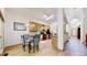 Bright eat-in kitchen with ample cabinetry, modern appliances, and skylights, offering a functional and stylish cooking space at 13673 Cook St, Thornton, CO 80602