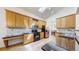 Well-equipped kitchen with plenty of cabinet space, modern appliances, and seamless connection to dining area, ideal for cooking at 13673 Cook St, Thornton, CO 80602