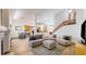 Spacious living room boasting an open floor plan, hardwood floors, and seamless flow to kitchen, ideal for entertaining at 13673 Cook St, Thornton, CO 80602