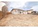 Home with a large backyard and a wood fence at 205 Hawthorn St, Frederick, CO 80530