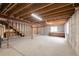 Spacious unfinished basement with exposed ceilings and concrete walls at 205 Hawthorn St, Frederick, CO 80530