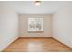 Empty, bright room with natural light and laminate flooring at 205 Hawthorn St, Frederick, CO 80530