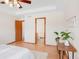 Bedroom with an open view to an en-suite bathroom, featuring natural light at 205 Hawthorn St, Frederick, CO 80530