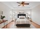 Cozy bedroom with a ceiling fan, bright windows, and well-staged decor at 205 Hawthorn St, Frederick, CO 80530