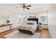 Comfortable bedroom featuring a ceiling fan, natural light, and neutral decor at 205 Hawthorn St, Frederick, CO 80530