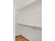 Walk-in closet with two levels of shelving and laminate flooring at 205 Hawthorn St, Frederick, CO 80530