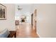 Long hallway with hardwood flooring leading into the spacious living room at 205 Hawthorn St, Frederick, CO 80530