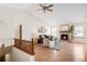 Comfortable living room with vaulted ceilings, a cozy fireplace, and ample natural light at 205 Hawthorn St, Frederick, CO 80530