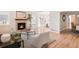 Spacious living room with a fireplace and hardwood flooring at 205 Hawthorn St, Frederick, CO 80530