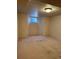 Unfinished basement space with carpet, small window, and ample potential at 6375 E 6Th Avenue Pkwy, Denver, CO 80220