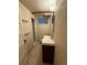 Bathroom featuring dark wood vanity, modern sink, updated fixtures and shower at 6375 E 6Th Avenue Pkwy, Denver, CO 80220