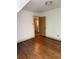 Spacious bedroom featuring hardwood floors and a doorway into a secondary room at 6375 E 6Th Avenue Pkwy, Denver, CO 80220