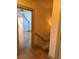 View of the hallway with beautiful hardwood floors and staircase leading to the upper level at 6375 E 6Th Avenue Pkwy, Denver, CO 80220