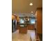 A large kitchen with stainless steel appliances, an island, and ample cabinet space at 6375 E 6Th Avenue Pkwy, Denver, CO 80220