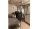 Spacious laundry room with sink, cabinetry, and stainless steel washer and dryer at 6375 E 6Th Avenue Pkwy, Denver, CO 80220