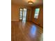 Living room boasts gleaming hardwood floors, and the beautiful french doors lead to another room at 6375 E 6Th Avenue Pkwy, Denver, CO 80220
