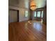 Hardwood floors gleam in the open-concept living room, and a bay window seat offers ample light at 6375 E 6Th Avenue Pkwy, Denver, CO 80220