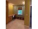 Office space with built in desk, cabinets, and a large picture window at 6375 E 6Th Avenue Pkwy, Denver, CO 80220