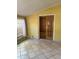 Bright sun room filled with light, featuring tile floors and views of the outdoors at 6375 E 6Th Avenue Pkwy, Denver, CO 80220