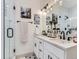 Elegant bathroom with a double vanity, modern fixtures, and a glass-enclosed shower at 1472 Yates St, Denver, CO 80204