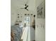 Bright bedroom with a vanity, decor, and a sliding glass door to the outside at 1472 Yates St, Denver, CO 80204