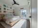 Inviting bedroom with slider access, a platform bed, side tables, and curated decor at 1472 Yates St, Denver, CO 80204