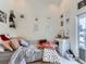 Bright bedroom featuring decor, a comfortable bed, and a vanity area, creating a serene retreat at 1472 Yates St, Denver, CO 80204