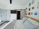 Serene bedroom featuring a bed, closet, decorative shelving and an adjacent walk-in closet at 1472 Yates St, Denver, CO 80204