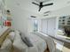 Inviting bedroom with slider access, a platform bed, side tables, and curated decor at 1472 Yates St, Denver, CO 80204