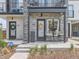 Charming front porch with seating area, creating a welcoming entrance to the home at 1472 Yates St, Denver, CO 80204