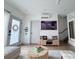 Open-concept living area featuring modern decor, art, wood floors, and minimalist design at 1472 Yates St, Denver, CO 80204
