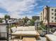 Relaxing rooftop patio featuring comfortable lounge seating and views of the surrounding neighborhood at 1472 Yates St, Denver, CO 80204