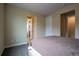 Neutral bedroom featuring carpet floors and two entry ways at 11259 Kalispell St, Commerce City, CO 80022