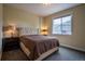 Cozy bedroom featuring soft, neutral tones, a comfortable bed, and a bright window for natural light at 11259 Kalispell St, Commerce City, CO 80022