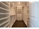 Organized walk-in closet with custom shelving and ample storage space for clothes and accessories at 11259 Kalispell St, Commerce City, CO 80022