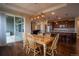 Dining area with backyard access and an open layout that seamlessly connects to the kitchen and living area at 11259 Kalispell St, Commerce City, CO 80022