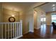 Hallway with hardwood floors leads into other rooms of the house at 11259 Kalispell St, Commerce City, CO 80022